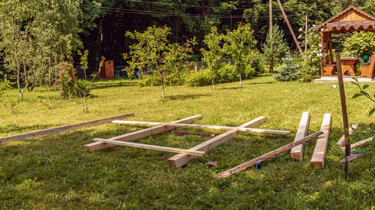 Wood planks positioned ready to build a raised bed.