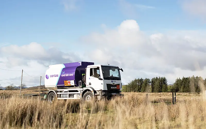Certas Energy truck driving through rural area.